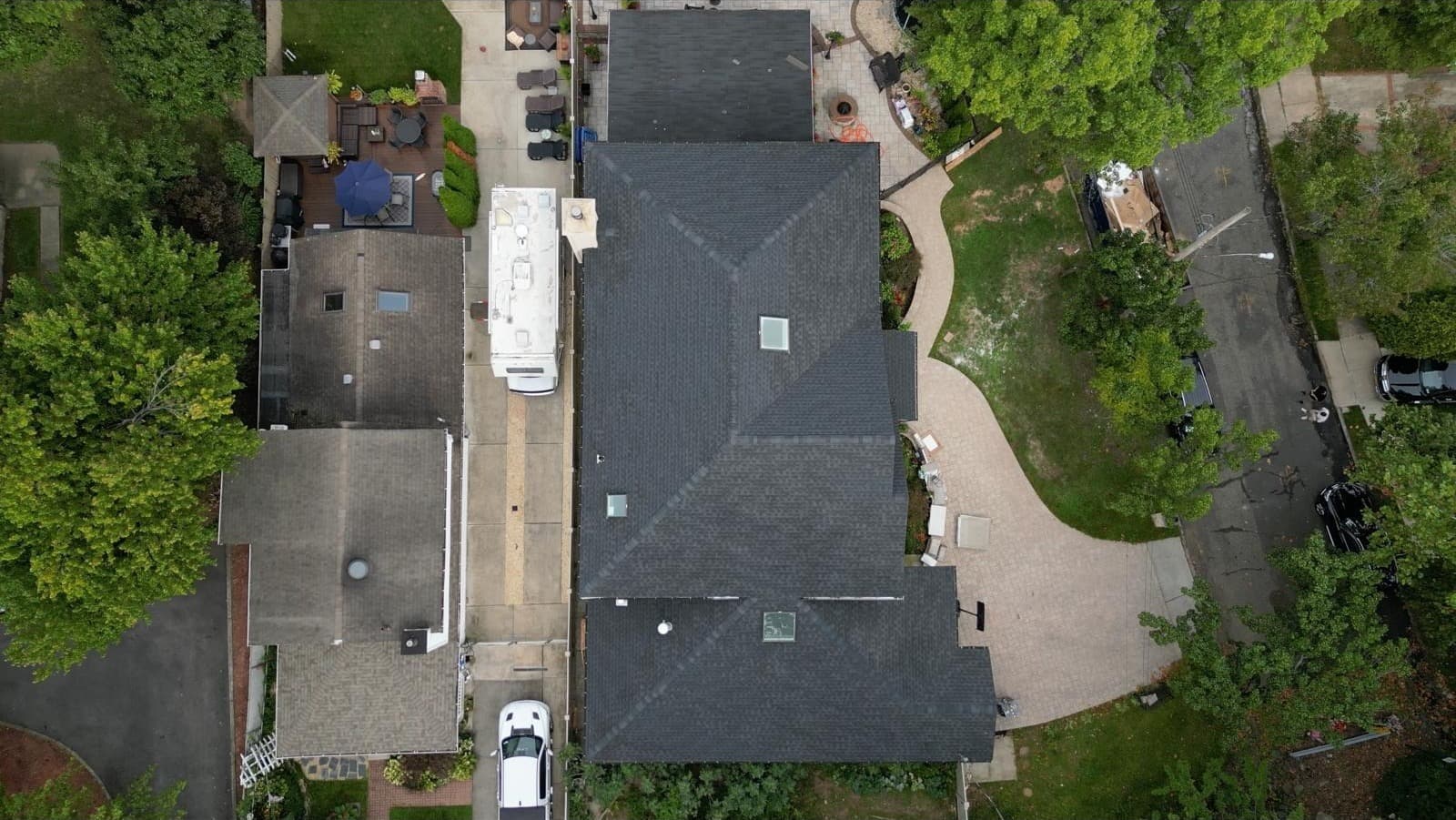Top-down view of completed estate roof with all wings visible