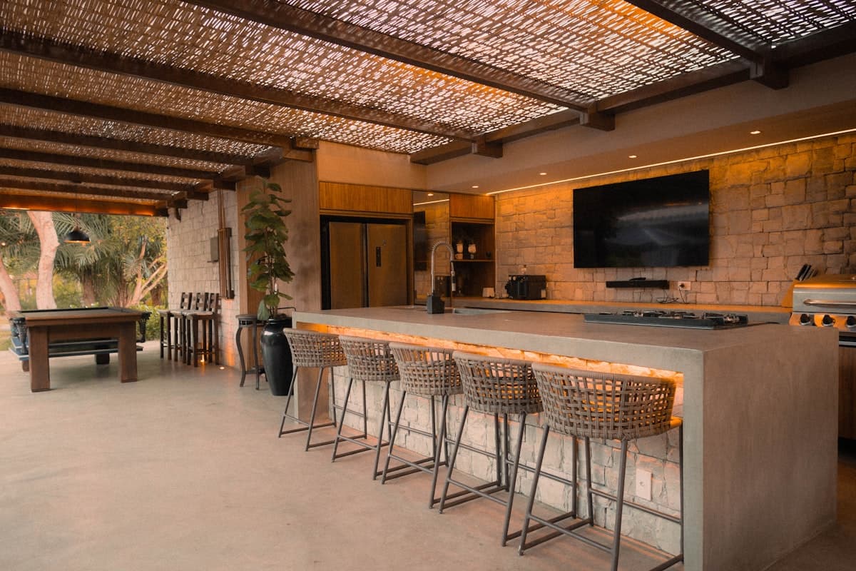 Covered outdoor kitchen with built-in grill